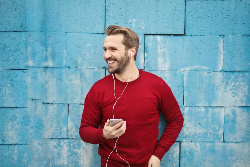 photo of a man learning how to speak English on his phone